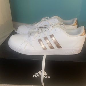 Adidas superstar shoes with gold/rose gold stripes